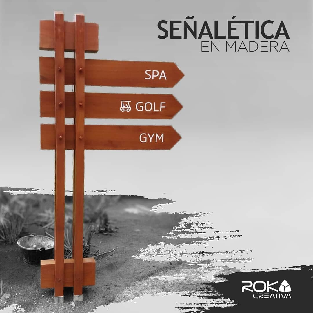 Composición gráfica de la señalética en madera diseñada para Abama